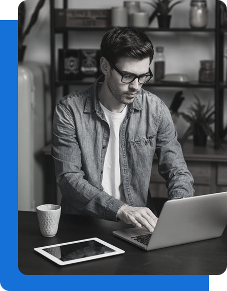 Engineer working at a computer with code on screen
